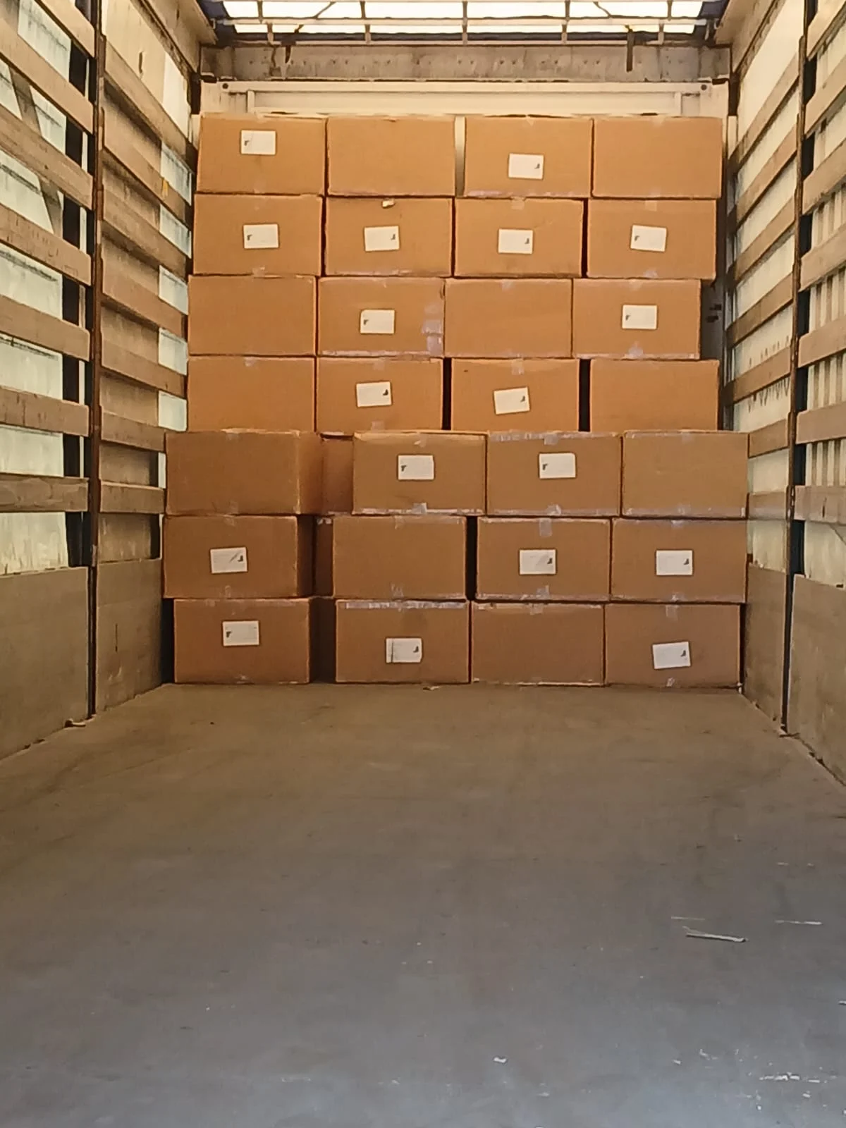 Cartons arranged inside the vehicle